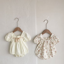 Load image into Gallery viewer, Available in White or pink fliral our girls puff sleeve rompers are a must have outfit for special occasions such as weddings, christenings and birthday parties. Shop our exclusive girls collection at Bel Banbini UK based online boutique today.