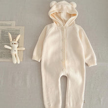 Load image into Gallery viewer, Knitted cotton baby hooded all in one suit with long sleeve arms and legs to keep comfortable and warm. Bear ears and a bear tail make this the sweetest little outfit, perfect newborn gift. Available in sizes up to 12months. Exclusive baby and toddler clothing at Bel Bambini baby boutique.