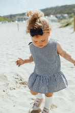 Load image into Gallery viewer, Gingham matching peplum top and bloomers in navy. Summer clothing for girls aged 0-2 years. Cotton summer outfits with a ribbon tie at the bak.