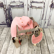 Load image into Gallery viewer, Girls Spanish style knitted cardigan in baby pink, fastened with three wooden buttons.