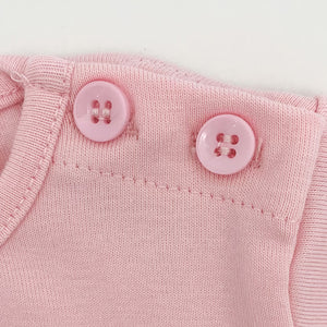 Buttyon detailing to the shoulder on the baby girls long sleeve tee.