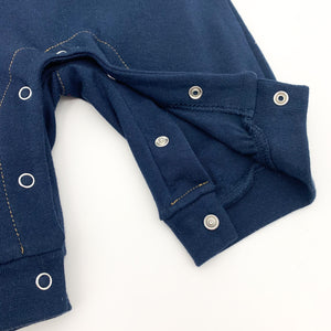 Popper fastenings to the crotch on our boys all in one dungaree romper. Long sleeves  age 0-24 months.