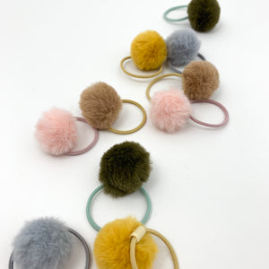 Shop our exclusive range of baby hair accessories, including our fluffy pompom bobbles with an elasticated band. Toddler hair bobbles with fluffy pompoms.