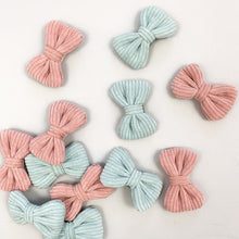 Load image into Gallery viewer, Creative photograph of our hair clips for girls, Pack of two available in baby blue and soft pink. Beautiful corduroy fabric makes these the most beautiful hair accessories for little girls. Exclusive to Bel Bambini accessories for toddlers and baby girls.