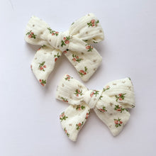 Load image into Gallery viewer, Ivory Floral bow hair clips for girls made in a soft cotton linen fabric, matched perfectly to our girls collection outfits. Exclusive to Bel Bambini baby and toddler boutique.