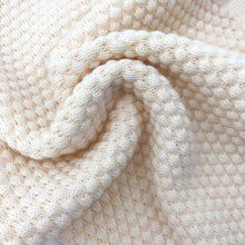 Load image into Gallery viewer, Detail showing our knitted lounge set for girls, Seed knit stitch detailing. Shop our baby and toddler winter knitwear styles online.