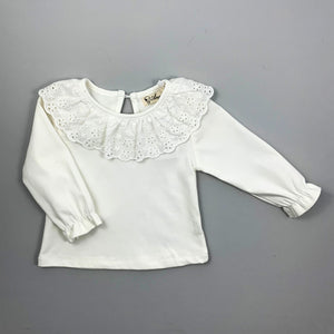 Toddler Long sleeved super soft blouse, sleeve cuffs have a flutter edge finish. A beautiful broderie anglaise lace trim to the neckling make this top so pretty and perfect to layer underneath dresses and rompers or wear with leggings, skirt or bottoms. Such a versatile top that can be dressed up or down.