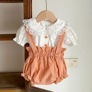 Beautiful baby girl clothing set, lace and embroidered ivory blouse and burnt orange bloomer dungarees. A super stylish set thats pretty and cute, pair with knee high socks and a bow headband to complete the look. Exclusive to Bel Bambini baby boutique.