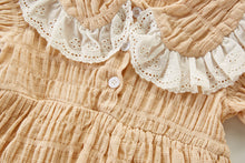 Load image into Gallery viewer, Deytail photo, textured fabrication which is subtle and beautiful made from 100% cotton. Lace trim girls romper. Button fastenings to the centre front.