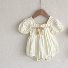 Load image into Gallery viewer, Beautiful white romper with a contrasting bow in a soft pink shade, gathering throughout the squared neckline and stylish puff sleeves. Perfect for family gatherings, special occasions and holiday outfits. Girls clothing from our stunning collections are available from our UK based online store.