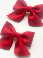 Load image into Gallery viewer, Cute hair bow clips for girls in our accessories collection. Red or pink available  for toddlers and young girls perfect to compliment Christmas outfits
