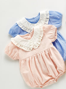 Frill neck romper for girls available in pink or blue. Pretty girls clothing exclusive to Bel Bambini baby boutique.
