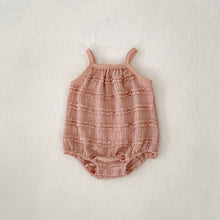 Load image into Gallery viewer, Textured romper suit for girls aged 0-3 years in dusty pink. Strappy shoulders and popper fastenings.
