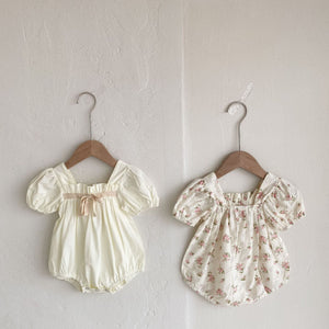 Available in White or pink fliral our girls puff sleeve rompers are a must have outfit for special occasions such as weddings, christenings and birthday parties. Shop our exclusive girls collection at Bel Banbini UK based online boutique today.