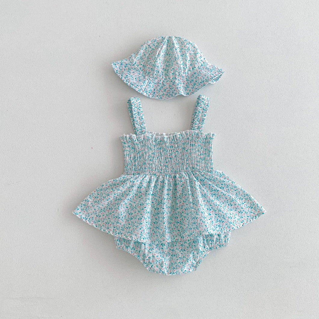 Red and turquoise cherry print on a white ground ensure this romper and hat set is stylish and beautiful for summer time. The A-line skirt and shirring to the chest allow for extra comfort. Available in sizes 0-3 years exclusively at Bel Bambini baby boutique.