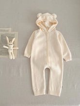 Load image into Gallery viewer, Knitted cotton baby hooded all in one suit with long sleeve arms and legs to keep comfortable and warm. Bear ears and a bear tail make this the sweetest little outfit, perfect newborn gift. Available in sizes up to 12months. Exclusive baby and toddler clothing at Bel Bambini baby boutique.