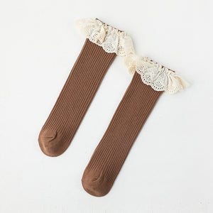 Brown knee high socks with a lace frill trim.
