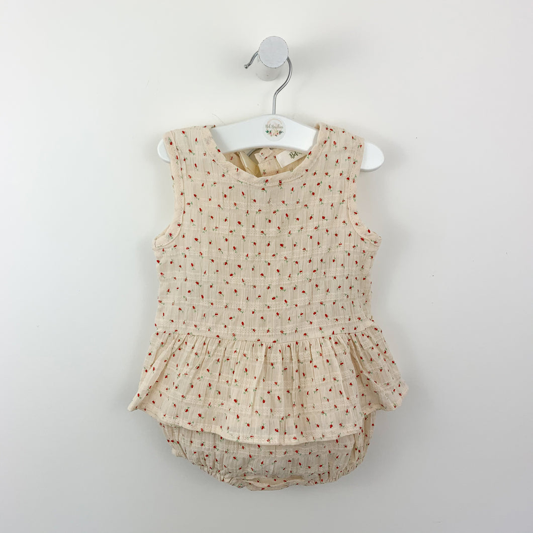 Baby girls set for up to 2 years. Our sleeveless peplum top comes complete with matching bloomers in a beautiful rose print on a soft cream ground. Textured cotton fabric for a lightweight summer fabric. Perfect baby gift. Exclusive to Bel Bambini baby boutique.