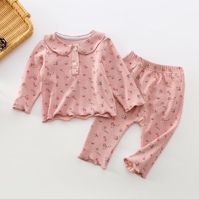 Baby girls flower print two piece set in pink floral. Available exclusively at Bel Bambini baby clothing boutique.