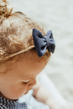 Load image into Gallery viewer, Our supersoft hairbands each have a corduroy bow. Available in packs of two, a variety of colours are available to pair with all your little ones outfits.