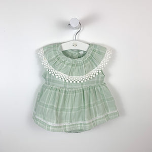 Baby girls romper dress in mint check print with crochet detailing to the neck and hem of the skirt. Made from 100% cotton so its breathable and lightweight on your little ones precious skin.
