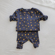 Load image into Gallery viewer, Baby lounge set. Toddler leggings and top set, comfortable clothing for baby and toddlers. A cute all over lemon print. Avavilable in charcoal or cream sizes 0-2 years. Exclusive to Bel Bambini fashion boutique UK.