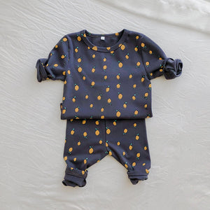 Baby lounge set. Toddler leggings and top set, comfortable clothing for baby and toddlers. A cute all over lemon print. Avavilable in charcoal or cream sizes 0-2 years. Exclusive to Bel Bambini fashion boutique UK.