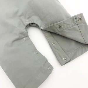 Popper fastenings allow for easy nappy changes on our boys dungarees in grey.