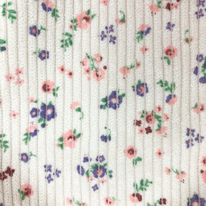 Ditsy floral detail shot from our corduroy romper from our spring girls collection.