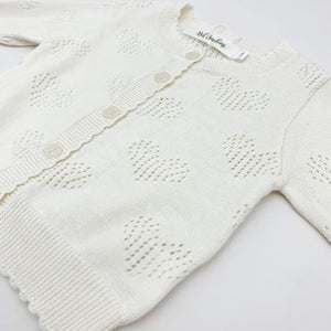 Heart detail openwork cotton knitted cardigan. Baby girls and toddlers need a lightweight summer cardigan for thiose cool evenings to keep warm. Long sleeve knitted cardigan in our new collection of spring summer baby clothing.