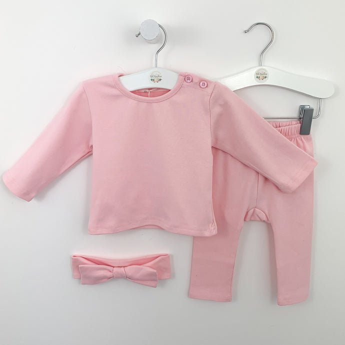 Loungewear set for baby girls aged 0-24 months in sugar pink. Set comes complete with a long sleeve top, leggings and a headband that all match. Button fastenings to the neck and elasticated waist on the leggings.