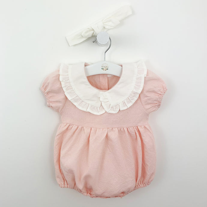 Pretty in pink baby girls frill collar romper. A swett little outfit complete with a white headband. Gingham print and puff sleeves. Gathered at the waist making this is beautiful style for girls aged 0=24 months. Shop our baby collections online at Bel Bambini baby boutique.