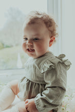 Load image into Gallery viewer, Baby girls romper exclusive to Bel Bambini. Stylish clothing for little girls. Gifts for baby and toddlers. Baby girl wearing our flutter detail romper in sage green.