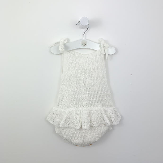 Girls summer romper. Delicately knitted in supersoft cotton, our white scallop knitted romper is perfect for the warm days as well as a great layering piece for  the colder days. Baby girl summer clothing. Baby rompers and toddler summer clothing exclusive to Bel bambini.