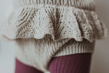 Load image into Gallery viewer, Detail shot showing the scallop frill on our knitted romper, available in sizes 0-24 months. Also available in mauve/ pink or taupe.