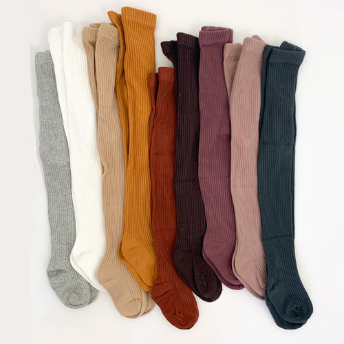 Ribbed tights for baby girls 0-2 years. Soft and comfortable rib knit tights in an array of 9 different colours. Tights for baby girls and tights for toddler girls. Warm rib knitted tights.