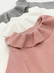 Girls rib knit sweater is available in ivory, grey or pink. Warm and comfortable top for baby and toddlers exclusive to Bel Bambini baby boutique.
