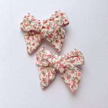 Load image into Gallery viewer, Pink Floral bow hair clips for girls made in a soft cotton linen fabric, matched perfectly to our girls collection outfits. Exclusive to Bel Bambini baby and toddler boutique.