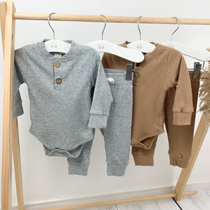Our loungewear sets are so comfortable for boys 0-2 years old. Long sleeves and super cute. Grey marl lounge set or tan lounge sets are available at Bel Bambini baby clothing boutique.