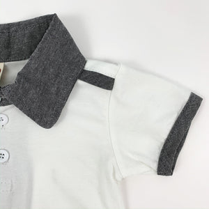 Baby and toddler tee to match the cute dungarees that they come with. Contrast binding on the short sleeve tee, with a contrast collar and stripe to the shoulder. Such a stylish set for little boys to wear.