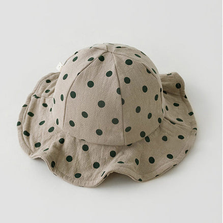 Baby boys floppy sunhats. Perfect polka dot printed sunhats in neutral shades for boys and girls aged 0-2 years. Floppy sunhats for girls. Protect your little ones face from the sun with our cotton sunhats for babies and toddlers up to 2 years old.