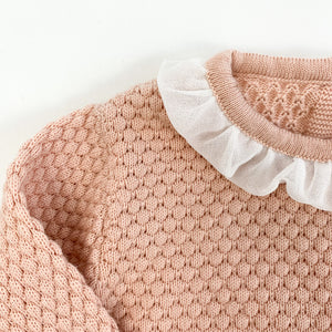 Detail shot of our Bel Bambini two piece knitted set in shell pink. Stunning girls outfit.