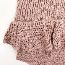 Load image into Gallery viewer, Photo showing a detail shot of our baby girls knitted romper in dusty pink. The scalloped frill to the hips make this such a beautiful style. Shop our romper collection online.