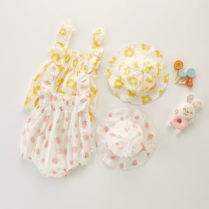 Summer sets for girls with sun hat and romper. Available in yellow floral print or pink strawberry print. For baby girls and toddlers aged 0-24 months. Shop exclusively at Bel Bambini baby boutique.