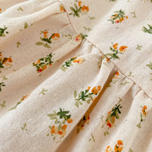 Load image into Gallery viewer, Pretty floral print in orange and green on a soft apricot base.