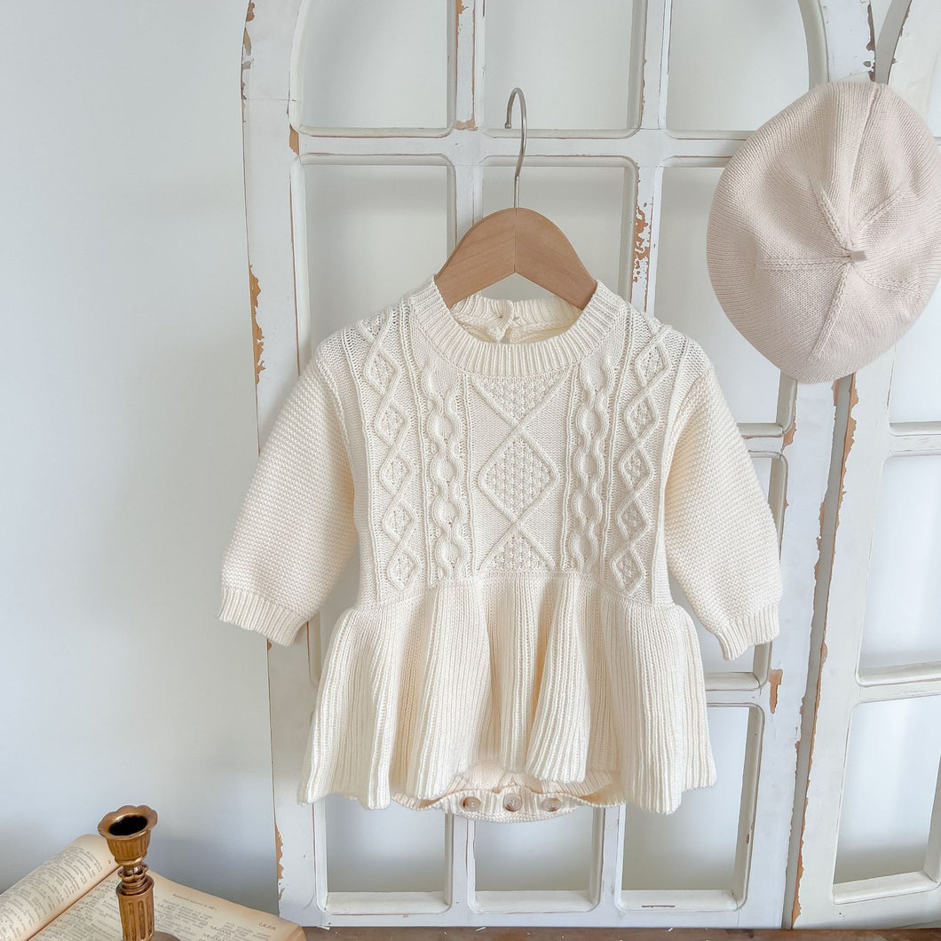 Mocha knitted romper for baby girls and toddler girls. Stylish autumn winter pieces that are exclusive to Bel Bambini baby and toddler clothing boutique. Shop our collections and enjoy free shipping on orders over £80.