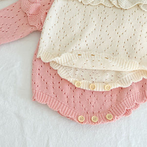 Button fastenings to the crotch allow for easy nappy changing