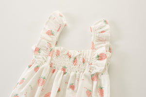 Strawberry printed summer set for girls. Frilled straps to the shoulders and a shirred look to the chest, lightweight cotton making this the perfect summer style. Shop at Bel Bambini baby and toddler clothing boutique.